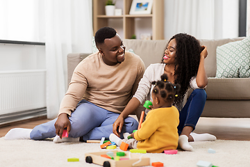 Image showing african family playing with baby daughter at home