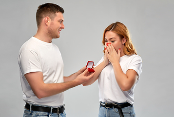 Image showing man giving woman engagement ring on valentines day