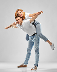 Image showing happy couple in white t-shirts having fun