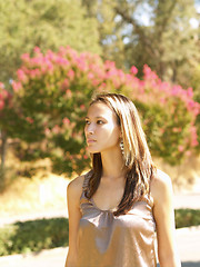 Image showing Young asian american woman outdoor portrait trees