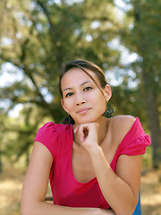 Image showing Young asian american woman portrait outdoors pink top