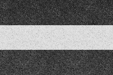 Image showing Black asphalt background texture with yellow line