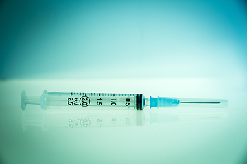 Image showing Syringe on blue background