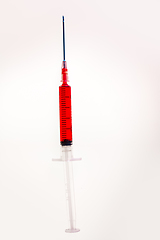 Image showing Syringe with blood on white background