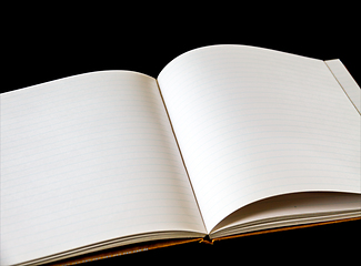 Image showing Open blank notebook on black background