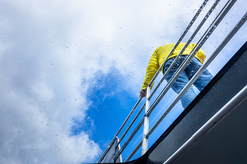Image showing rainy day tour man at a railing