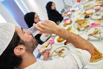 Image showing Starting Iftar dinner during Ramadan holy month