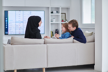 Image showing Happy Muslim family spending time together in modern home