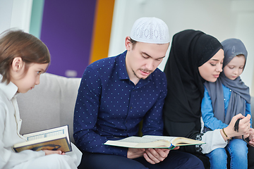 Image showing Young muslim family reading Quran during Ramadan