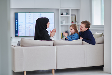 Image showing Happy Muslim family spending time together in modern home