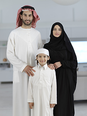 Image showing young arabian muslim family wearing traditional clothes