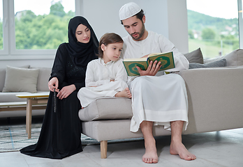 Image showing Young muslim family reading Quran during Ramadan