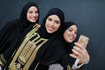 Image showing Portrait of Arab women wearing traditional clothes or abaya