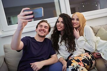 Image showing Young happy, muslims taking selfie in house