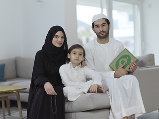 Image showing Young muslim family reading Quran during Ramadan