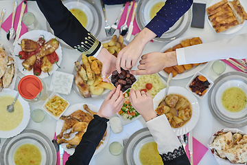 Image showing Top view of muslim family having Iftar during Ramadan holy month