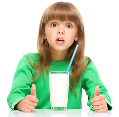 Image showing Cute little girl with a glass of milk