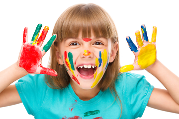 Image showing Portrait of a cute girl playing with paints