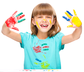 Image showing Portrait of a cute girl playing with paints