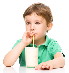 Image showing Cute little boy with a glass of milk