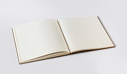 Image showing Open blank notebook isolated on grey