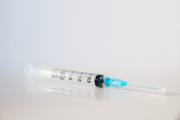 Image showing Syringe on grey background