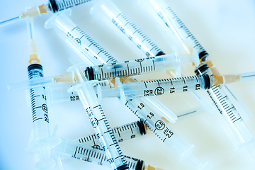 Image showing Syringes on blue background