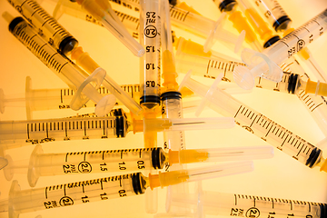 Image showing Syringes on orange background