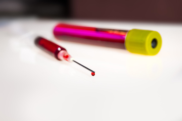 Image showing Syringe needle and tube with blood