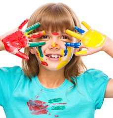 Image showing Portrait of a cute girl playing with paints