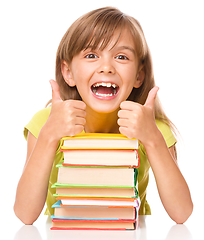 Image showing Little girl with her books