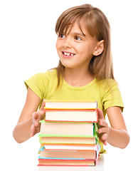 Image showing Little girl with her books