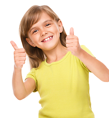 Image showing Little girl is showing thumb up sign