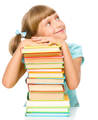 Image showing Little girl with books