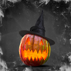 Image showing Scary pumpkin on black smoke background, the night of fear