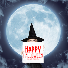 Image showing Young woman in hat as a witch on moon background