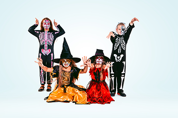 Image showing Kids or teens like witches and vampires on white background