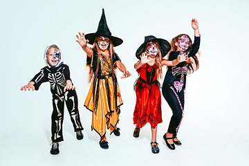 Image showing Kids or teens like witches and vampires on white background