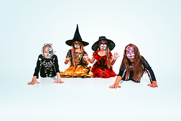 Image showing Kids or teens like witches and vampires on white background