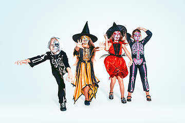 Image showing Kids or teens like witches and vampires on white background