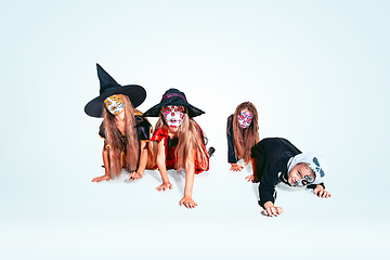 Image showing Kids or teens like witches and vampires on white background