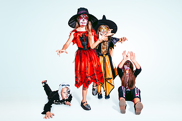 Image showing Kids or teens like witches and vampires on white background