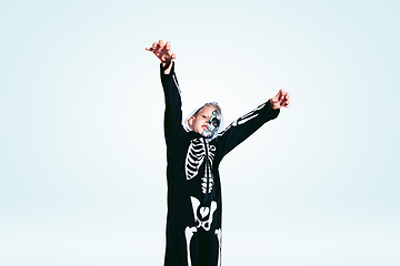 Image showing Little boy like a vampire on white background