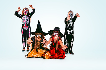 Image showing Kids or teens like witches and vampires on white background