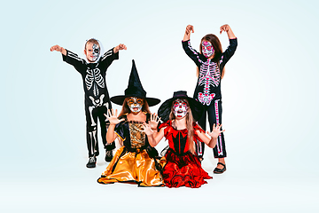 Image showing Kids or teens like witches and vampires on white background