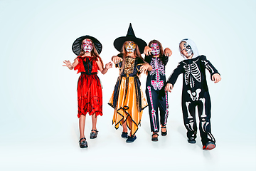 Image showing Kids or teens like witches and vampires on white background