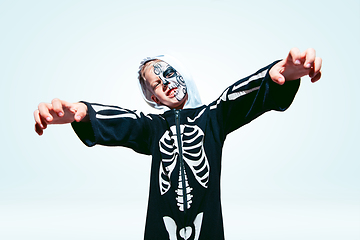 Image showing Little boy like a vampire on white background