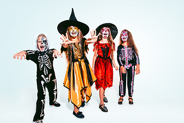 Image showing Kids or teens like witches and vampires on white background