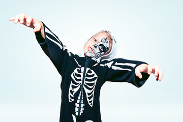 Image showing Little boy like a vampire on white background