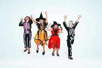 Image showing Kids or teens like witches and vampires on white background